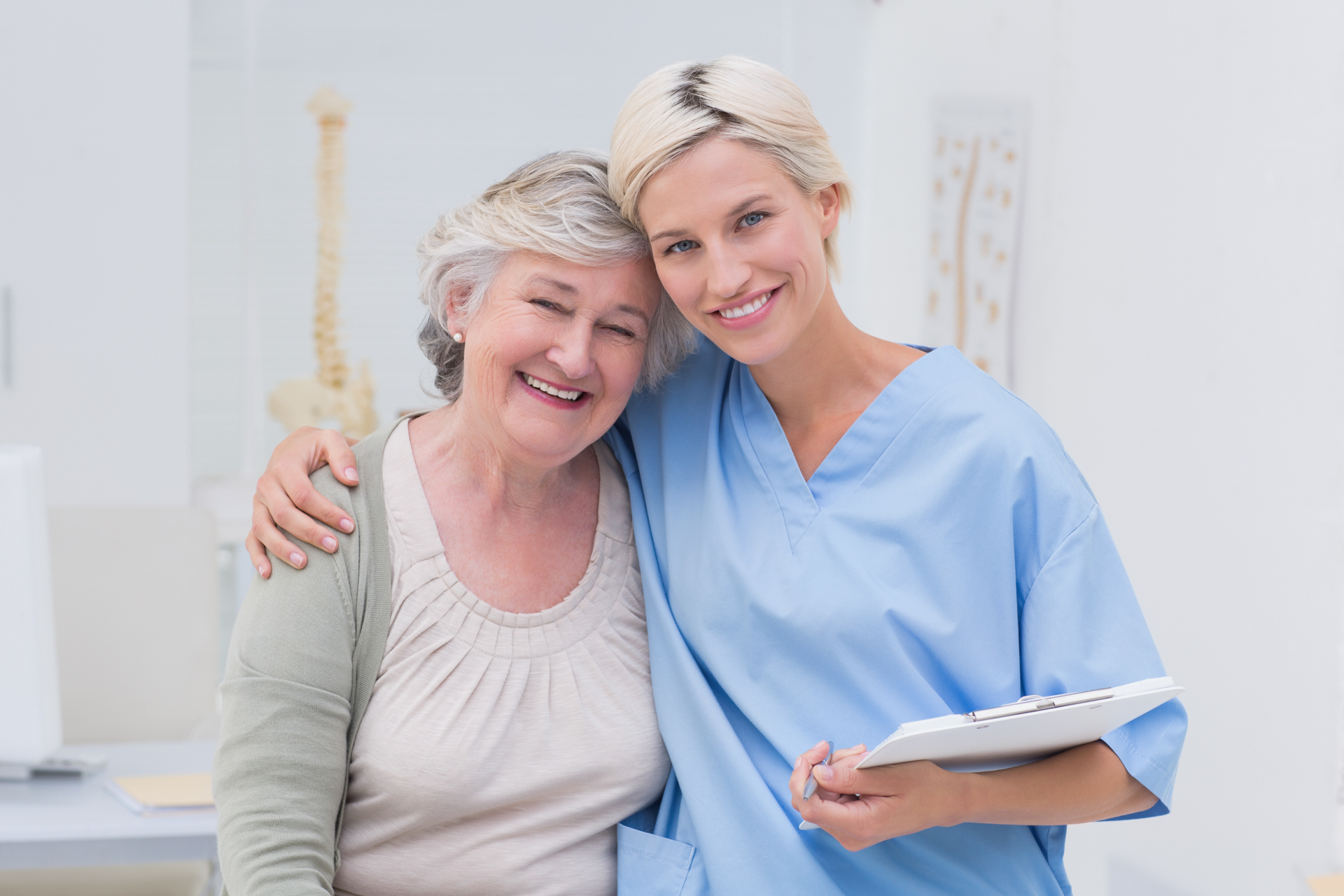 Caregiver and patient smiling for a photo