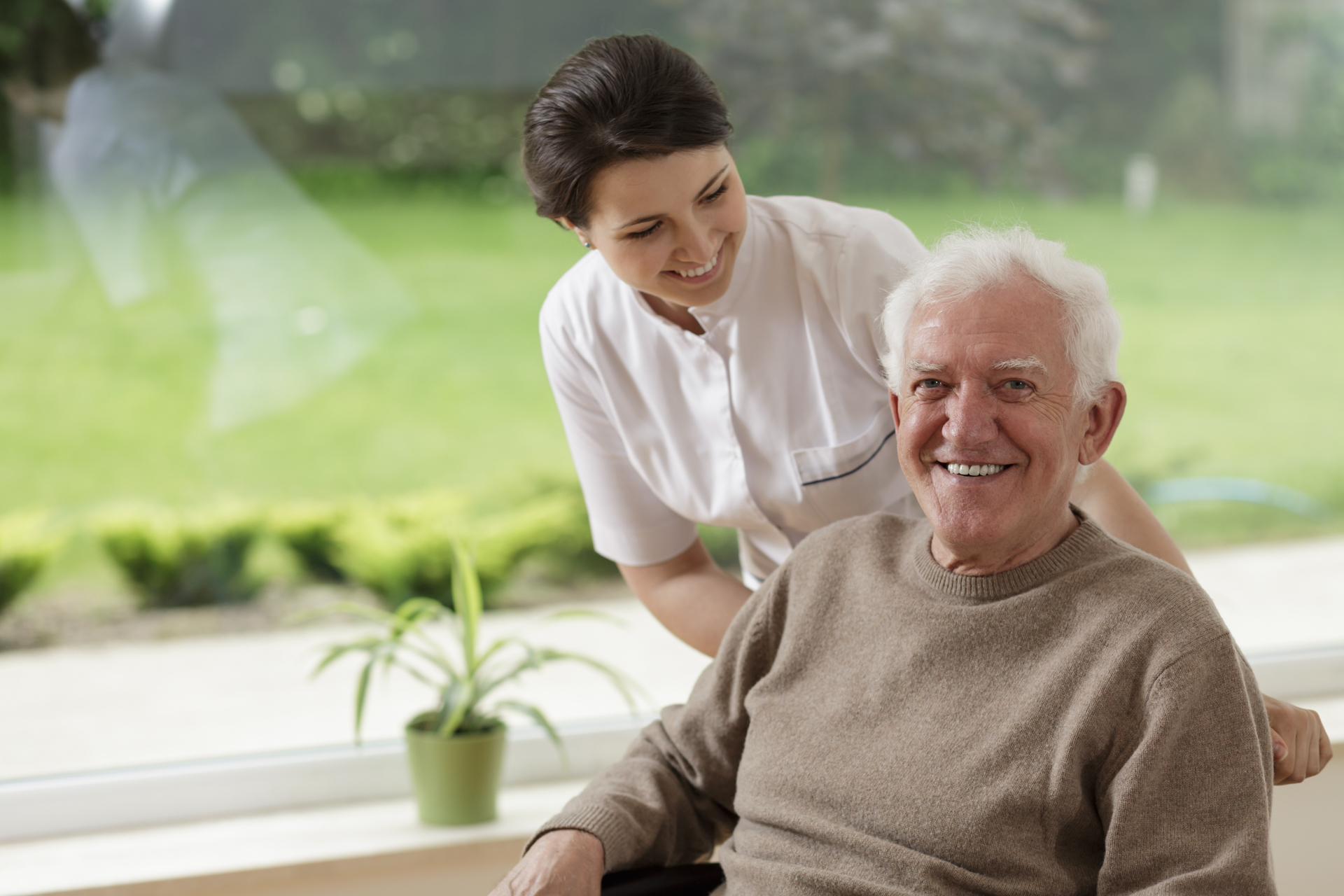Caregiver posing with a elderly client.